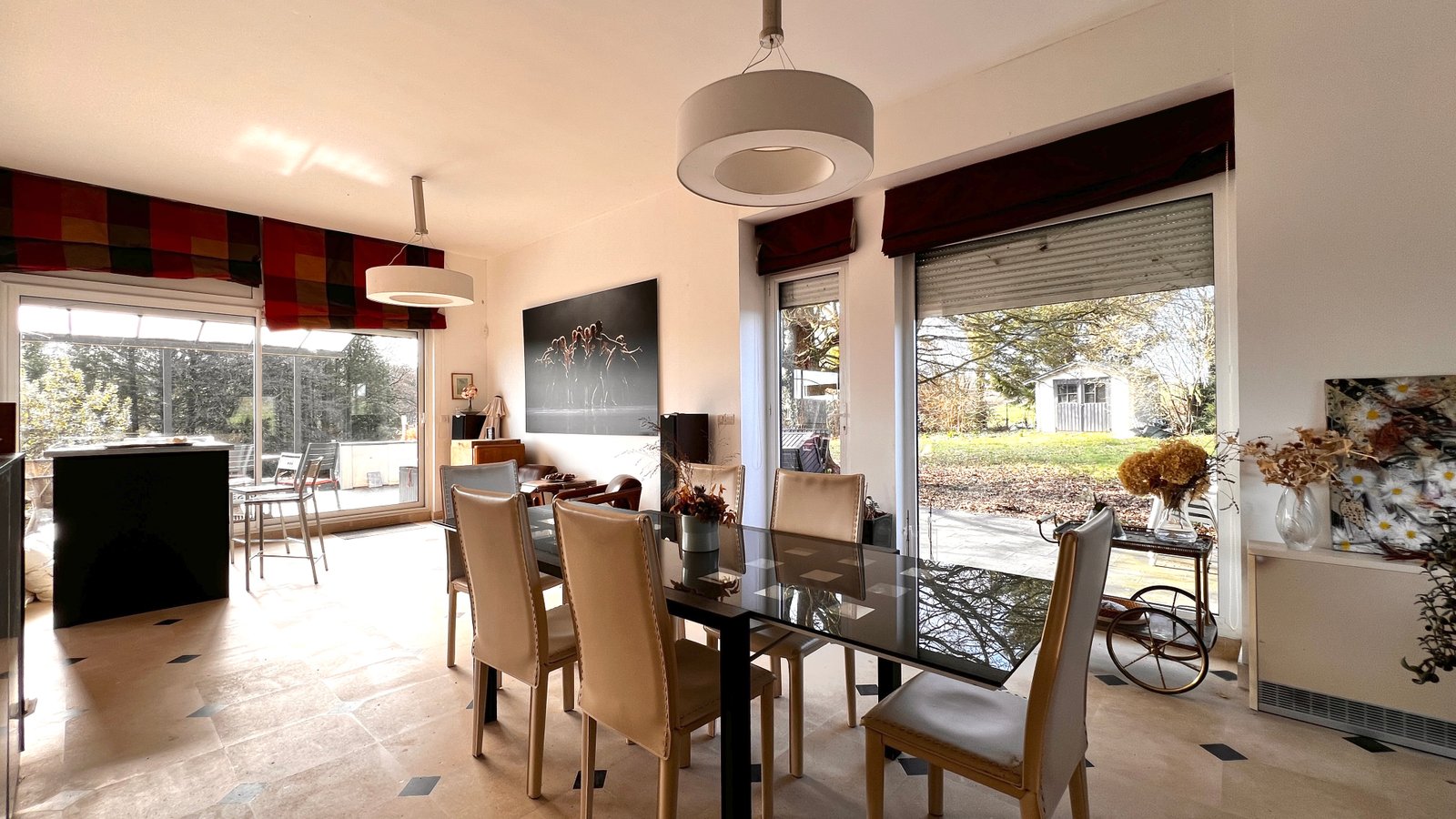 Dining room opening onto the terrace of the Longpont property